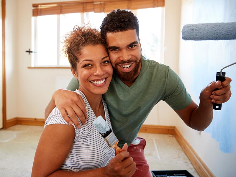 Couple with paint roller